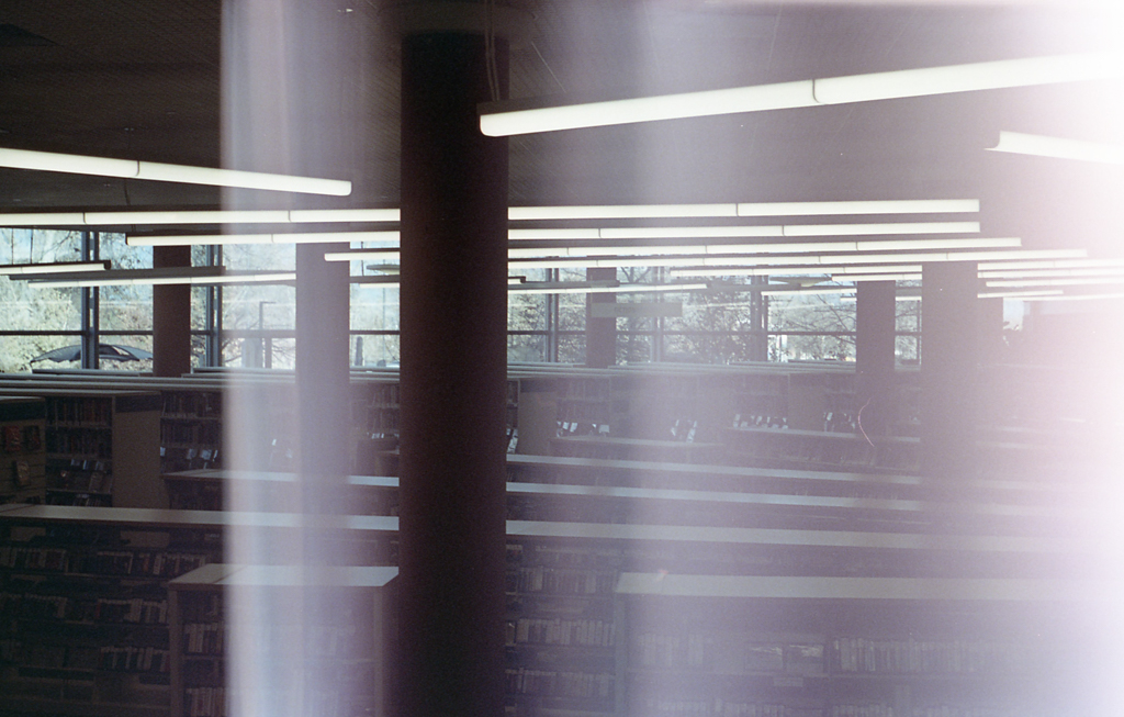 A library has been overexposed on the right side, leading to bands of white across the image and a consuming glow emanating from the right edge.
