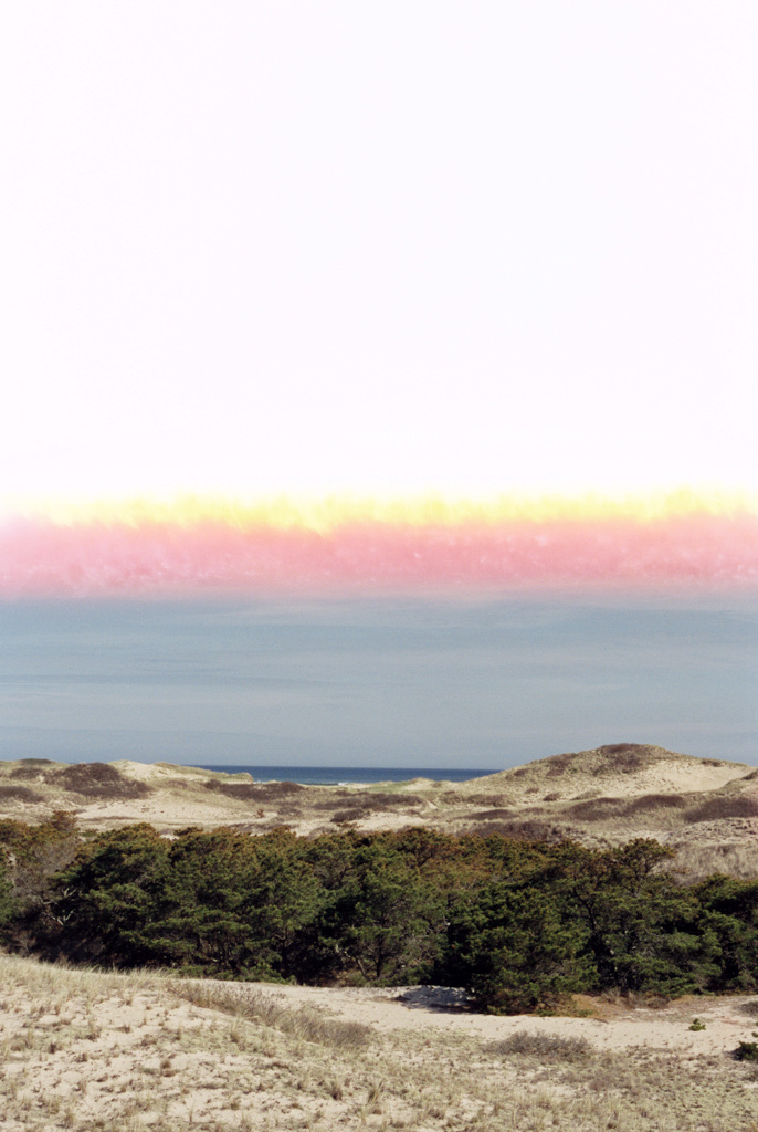 A beach in Cape Cod in smooth pastels. The top half of the image is pure white from exposure when loading the roll.