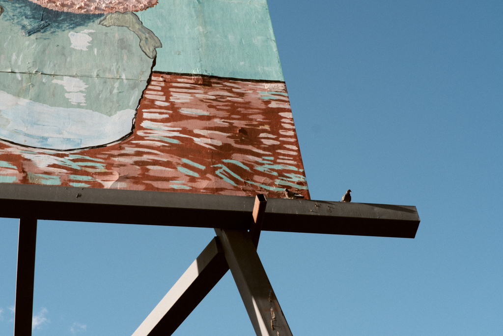 A bird perched on the easel of the world's largest Van Gogh painting in Goodland, Kansas.